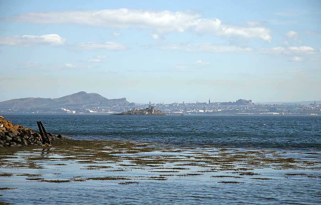 Inchmickery and the skyline of Edinburgh, seen from beside the Island of Inchcolm in the Firth of Forth