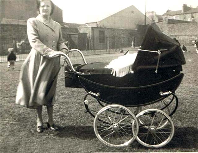 Keith Flockhart in pram with his grandmother,  Keddie Gardens, Leith - around 1958