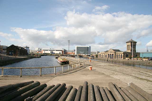 View, looking along Alexandra Dock beside the old swing bridge in Leith Harbour, towards Ocean Terminal shopping centre and cinema complex.