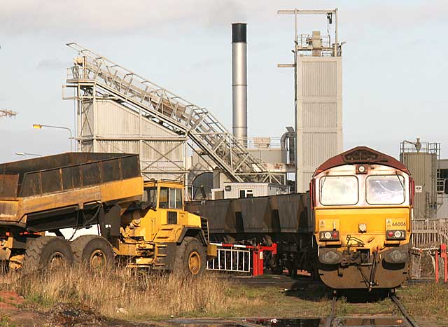 A freight train of empty coal wagons reverses into Leith Docks to piick up imported coal for delivery to power stations