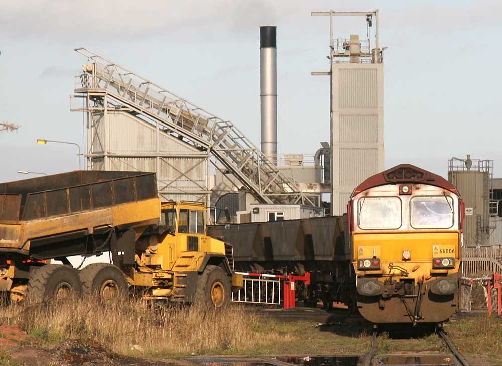 A freight train of empty coal wagons reverses into Leith Docks to piick up imported coal for delivery to power stations