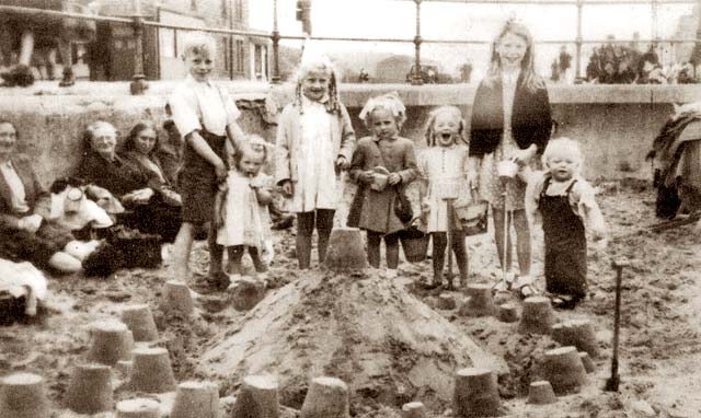 beach sand castle. Family and Sand Castle on the