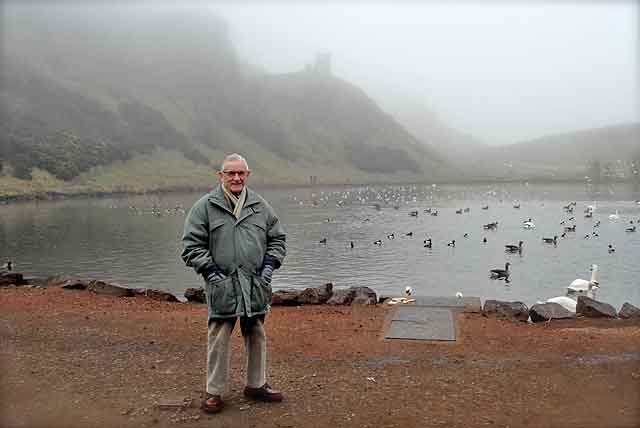 Wullie Croal standing beside St Margaret's Loch in Holyrood Park