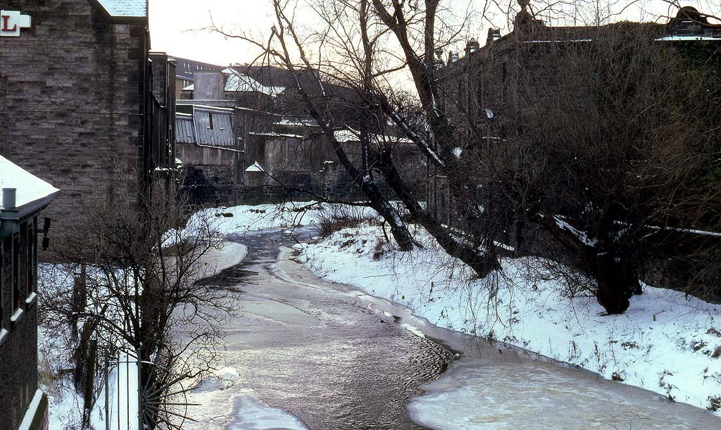 View up the Water of Leith from the bridge at Canonmills