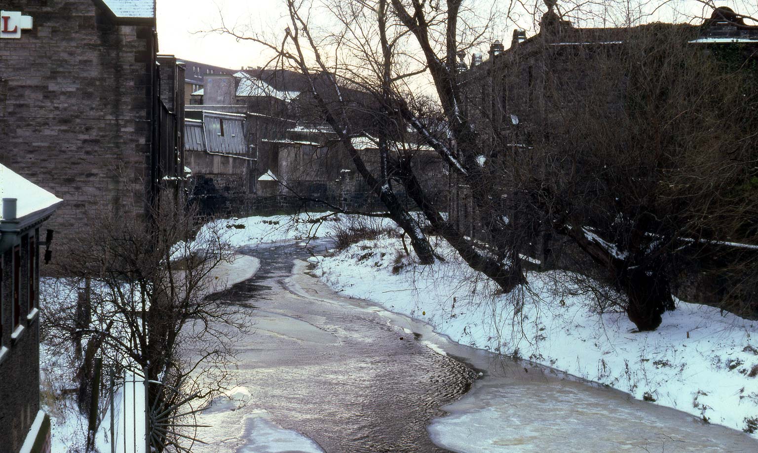 View up the Water of Leith from the bridge at Canonmills