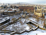 Looking down on the Caledonian Hotel and St Cuthbert's Church and graveyard from Edinburgh Castle  -  January 2010