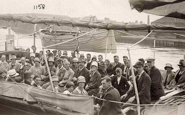 Sailing on a boat with an advert for an aquarium, taken possibly around 1928  -  Where was this photo taken?