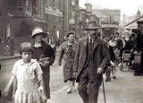 Photograph of a street scene with tram and a sign for Belamine Bread  -  Where might this photo have been taken?