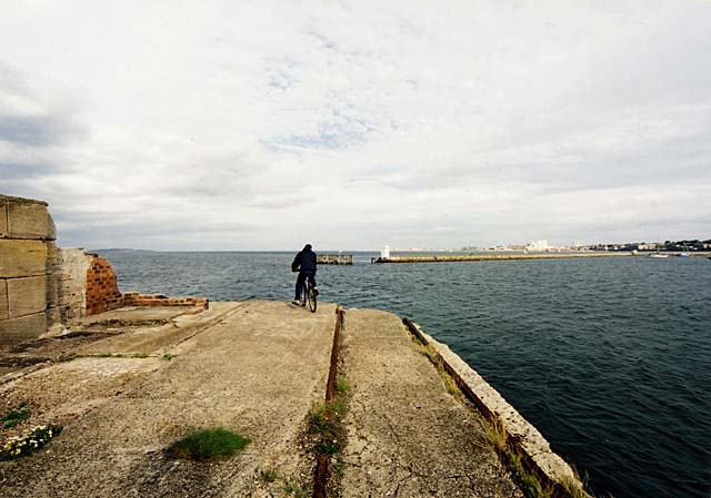 Edinburgh Waterfront  -  A cyclist reaches the end of Western Breakwater, Granton Harbour  -  14 September 2003