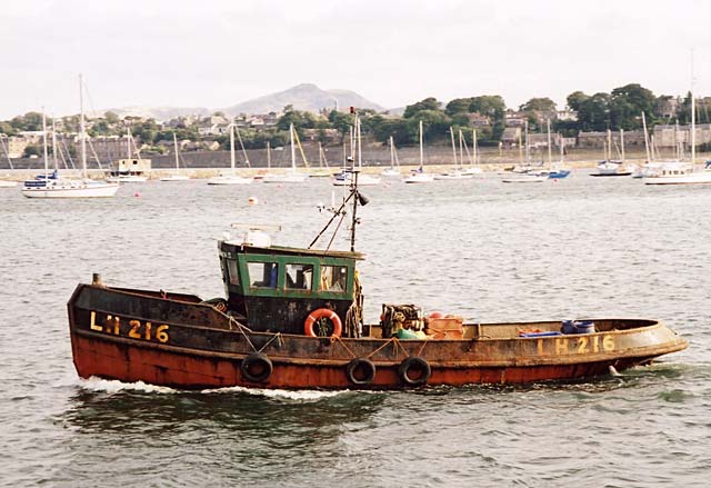 Edinburgh Waterfront  -  LH216 leaving Granton's Western Harbour with Arthur's Seat in the background  -  14 September 2002