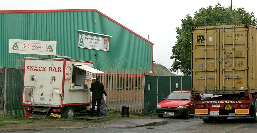 Zoom in to a photograph of a heavy lorry passing a snack bar in West Harbour Road, Granton  -  July 2006