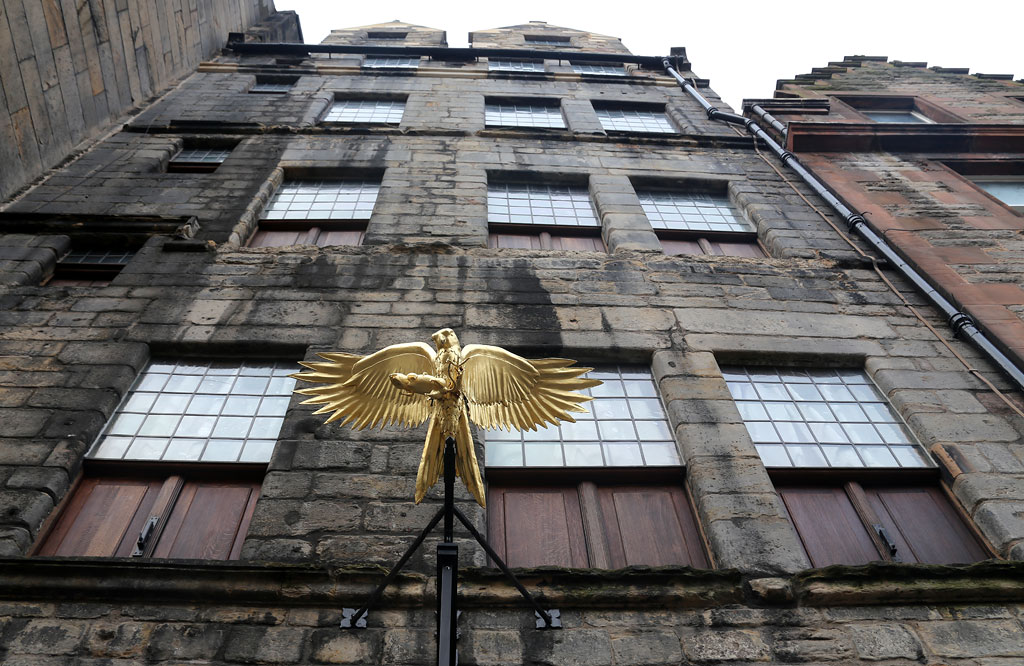 Gladstone's Land - Gilt-copper sign - Hawk with a mouse in its claws