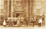 Horse and cart parked outside the Main Entrance to the Palace of Holyroodhouse, beneath the Coat of Arms  -  Photograph by FE Bailey  -  When might this photo have been taken?