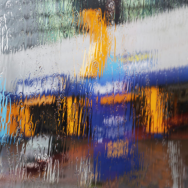 Photo taken in the rain from the front seat on the upper deck of a Lothian Bus  -  Kwikfit Garage, oposite Fountain Park, Fountainbridge