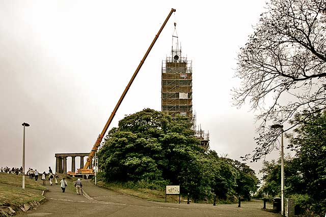 The time ball is raised to the top of of the Nelson Monument