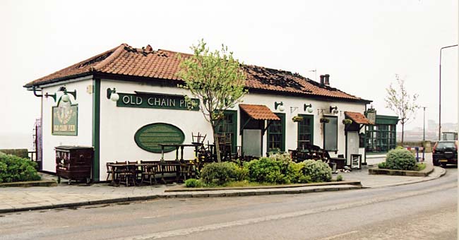 The Old Chain Pier with a damaged roof following a fire  -  view from the south-west,  April 2004