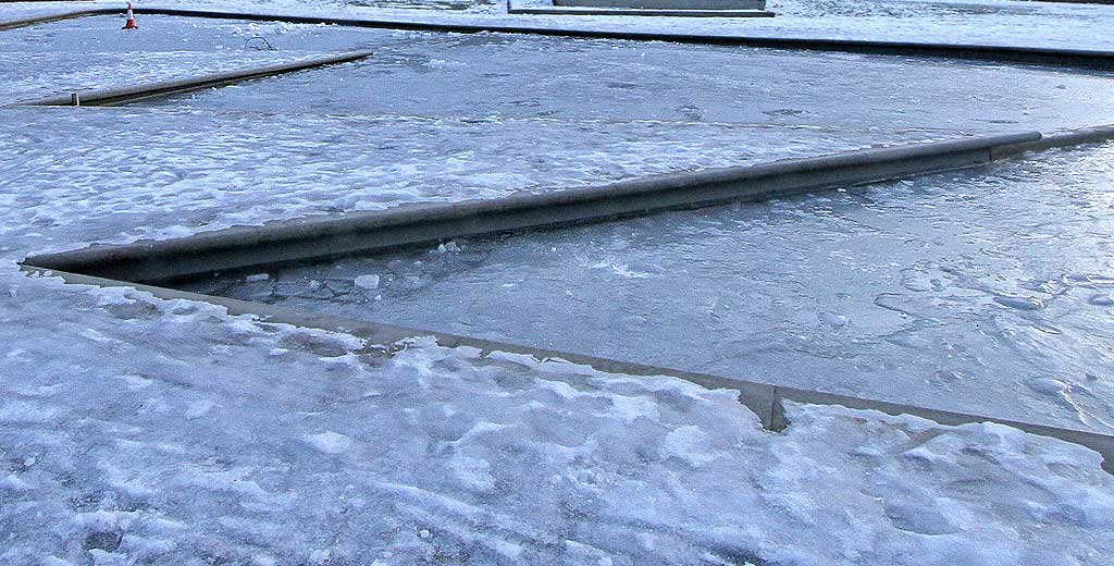 Ice on the shallow ponds outside the Scottish Parliament  -  December 2009