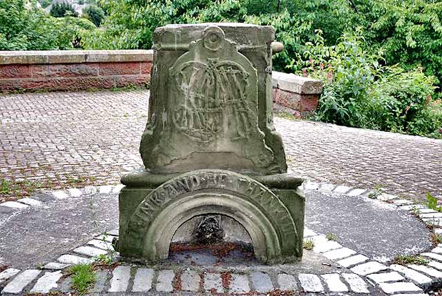 Stones from the Sinclair Fountain, installed beside the cycle path at Steadfastgate, beside Gosford Place, Bonnington, Edinburgh