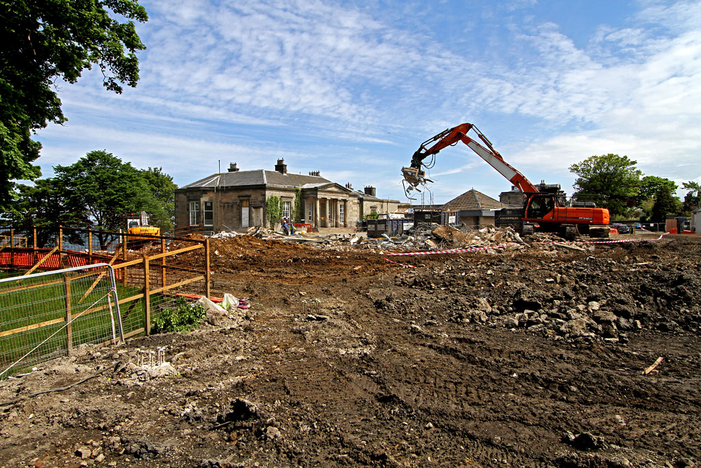 St Columba's Hospice  - Piling work complete and demolition almost complete.  The view opens up to show the C19 Challenger Lodge building, June 2012