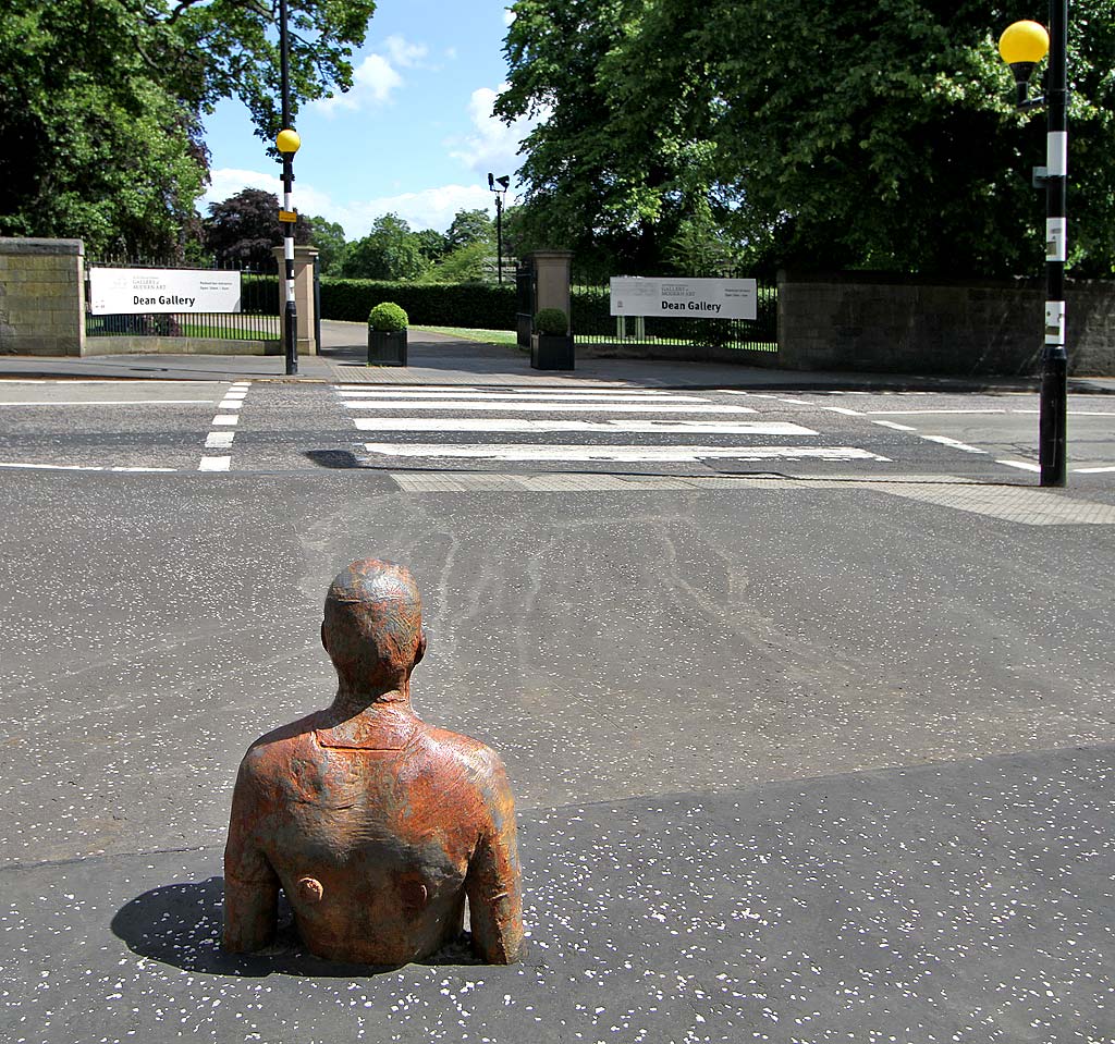 One of the livesize cast iron figures in the artwork '6 Times' by Antony Gormley. The statues