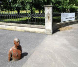 One of the live-size cast iron figures in the artwork '6 Times' by Antony Gormley.  The statues are sited, most in the Water of Leith, between the Scottish National Gallery of Modern Art and Leith Docks