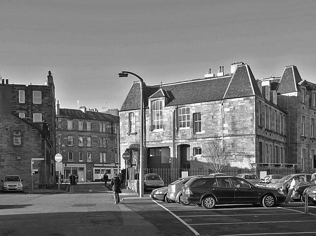 Car park and Yardheads School, now converted to housing.  The car park in the foreground is where the hairdresser at the corner of Green Jenny's Close and Giles Street once stood.  