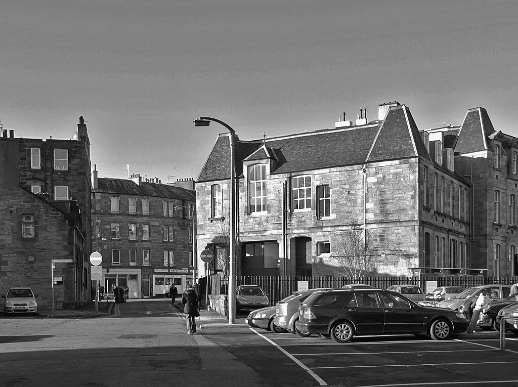 Car park and Yardheads School, now converted to housing. The car park in the foreground is where the hairdresser at the corner of Green Jenny's Close and Giles Street once stood.
