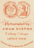 Zoom in to the back of a carte de visite depicting two medals awarded to Adam Diston