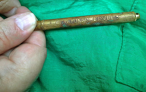 Metal Pencil Holder marked with the name of Crawford's Biscuits