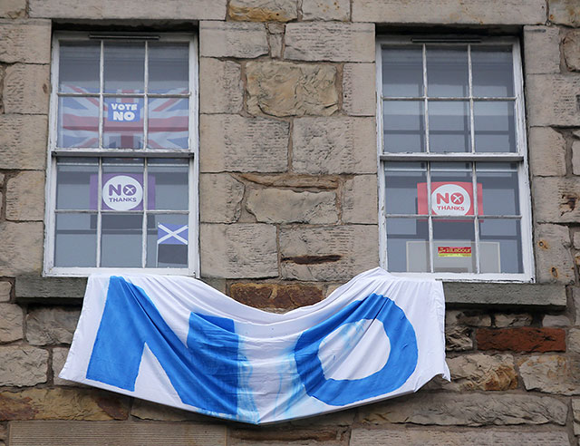 Photos taken in Edinburgh on the two days leading up to the Scottish Referendum Vote on 18 September 2014  -  'No' Banner and 'No' Posters on Tenement above Starbucks on the corner of Nicolson Street and East Crosscauseway, South Side