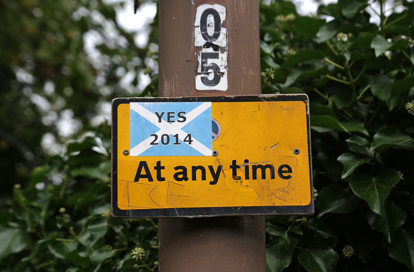 Photos taken in Edinburgh on the two days leading up to the Scottish Referendum Vote on 18 September 2014  -  'Yes 2014' sticker on a 'No Waiting' sign at Gilmerton Road, Newington.