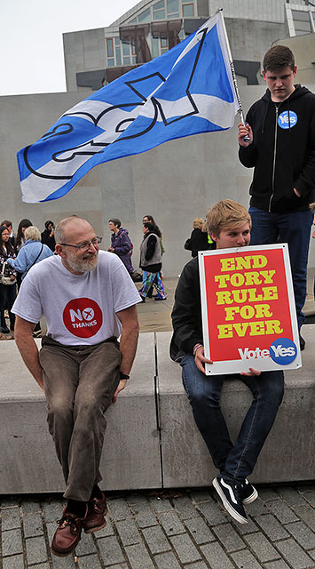 Photos taken in Edinburgh on voting day in the  Scottish Indepemdence Referendum on 18 September 2014  -  Outside the Scottish Parliament  -  'Yes' and 'No' supporters