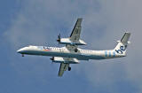 De Havilland Canada DHC-8Q-402 Dash 8 above the Firth of Forth between Granton and Cramond, approaching Edinburgh Airport, on flight to Edinburgh, August 24, 2009