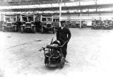 Central Garage, Annandale Street  -  Man with a starting handle machine and buses in the background