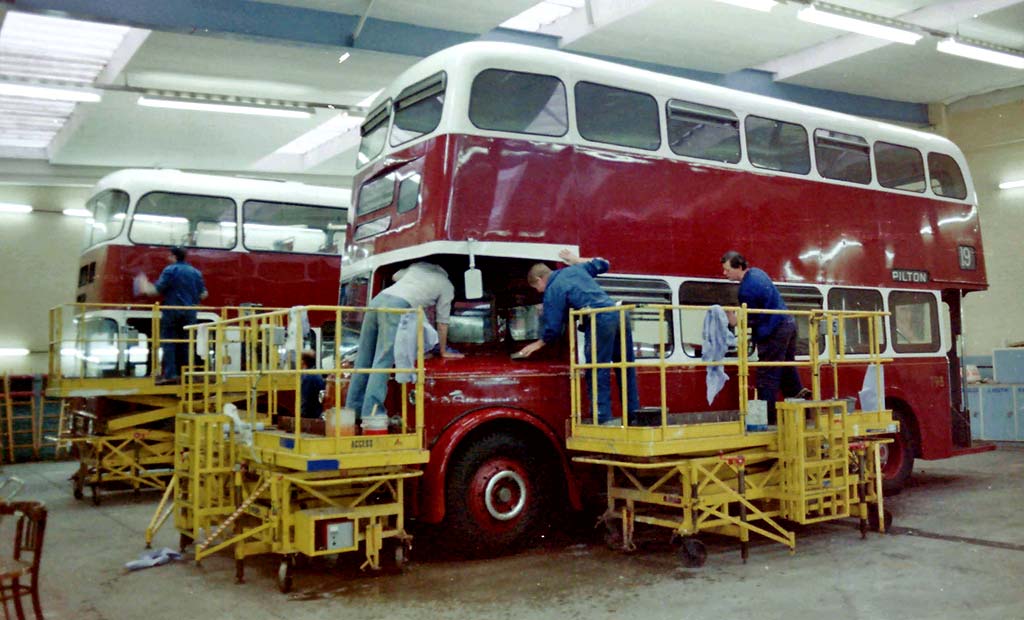 Two buses, one a Leyland Titan PD2 being painted at Seafield