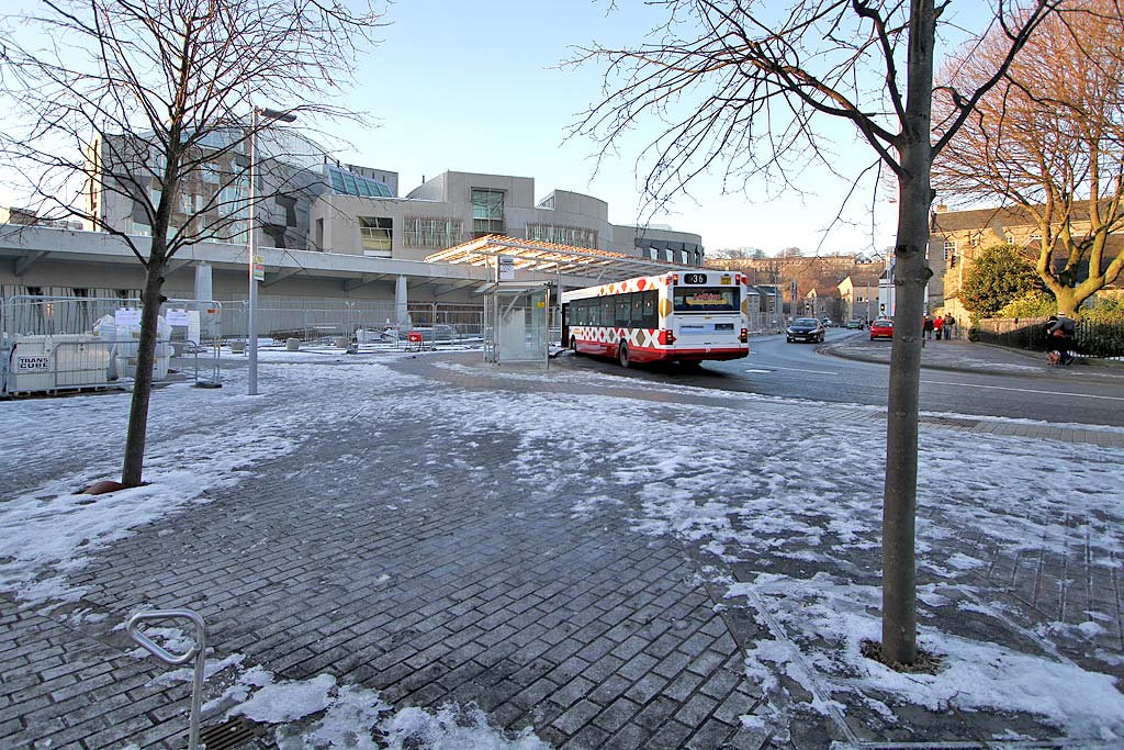 Holyrood Terminus of Lothian Buses Route 36 and Park keeper's house near the entrance to Holyrood Park at the Scottish Parliament