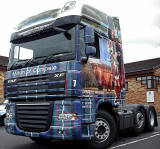 Truck decorated with photos, including my photograph of highland cow