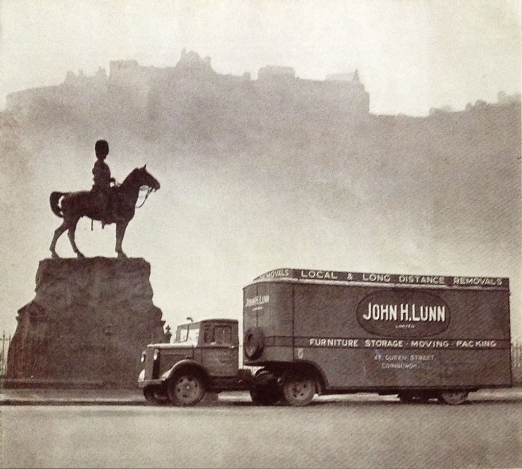 John H Lunn Removal Van parked in Princes Street in front of the Royal Scots Greys Memoril  -  Photo taken from a Lunn pamphlet, probably around 1930s