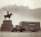 John H Lunn Removal Van parked in Princes Street in front of the Royal Scots Greys Memoril  -  Photo taken from a Lunn pamphlet, probably around 1930s