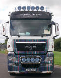 Truck decorated with photos, including my photograph of highland cattle in the snow.