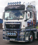 Truck decorated with photos, including my photograph of highland cow