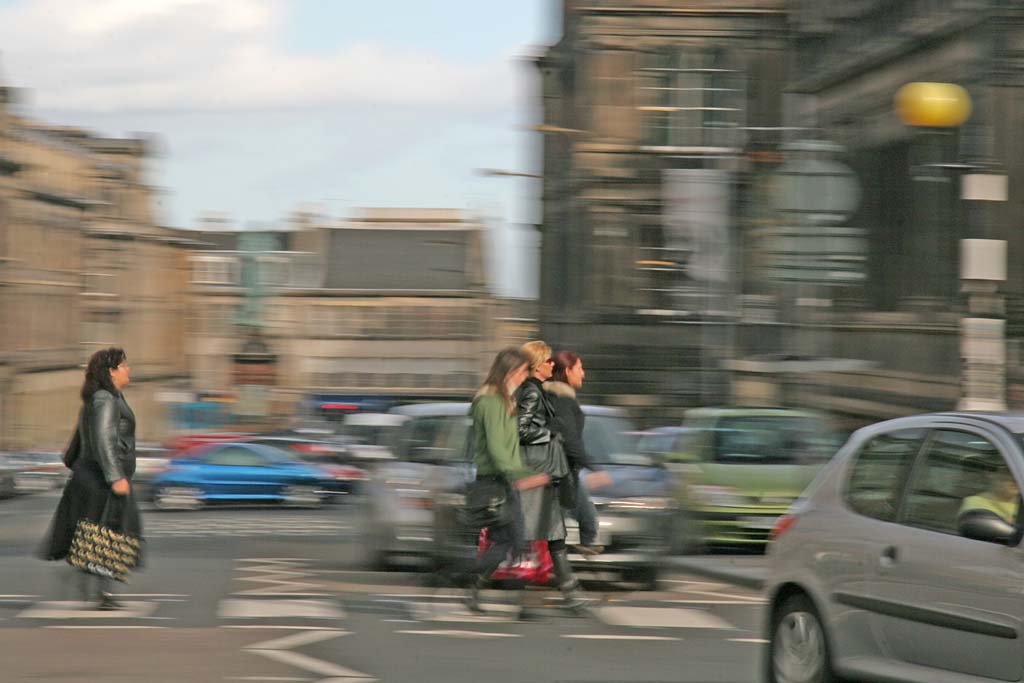 Pedestrians crossing Chambers Street heading towards the National Museum of Scotland