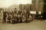 A group of fourteen railway workers at Craigentinny, with Arthur's Seat in the background