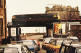 The 'track lifting' train crosses Trinity Bridge, a short distance to the wesst of Trinity Station on the line to Granton Harbour, 1986