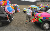 Edinburgh Taxi Trde Children's Outing, 2012  -  Decorated Taxis in the Car Park at Murrayfield, and one Taxi Driver  - "All Aboard the Clown Mobile"