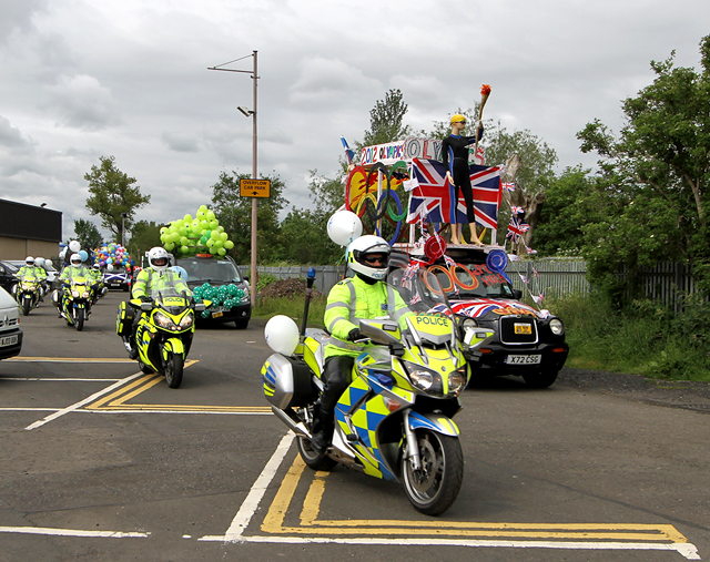 Edinburgh Taxi Trde Children's Outing, 2012  -  The Outing begins - led by the "Olympics 2012 Taxi" with Police Motorcycle Escort