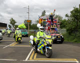 Edinburgh Taxi Trde Children's Outing, 2012  -  The Outing begins - led by the "Olympics 2012 Taxi" with Police Motorcycle Escort