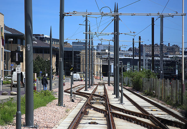 Edinburgh Tram Service  - Approaching Haymarket on the journey to York Place.  Edinburgh Castle is on the horizon -  June 2014