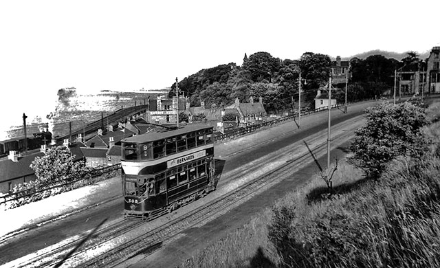 Edinburgh Tram in 1950s?  -  Granton Road, with a train and Wardie Hotel beside Lower Granton Road in the background