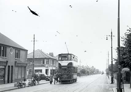 Tram and Tram Stop in Granton Road, Edinburgh  -  Photograph taken from above the railway at Granton Road Station.